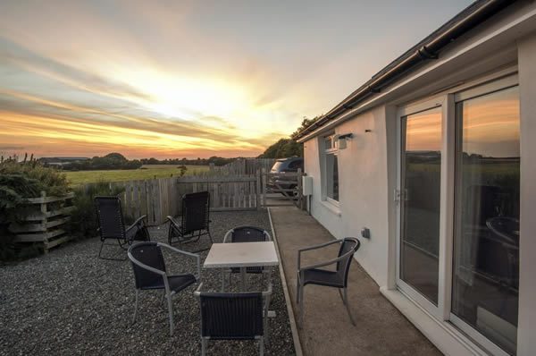 Sunset at Ballacamaish self catering farmstay cottages